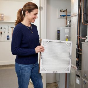 A clean residential HVAC system being maintained with a fresh, brand new air filter change.