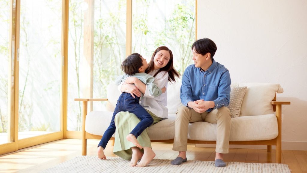 family relaxing on a couch
